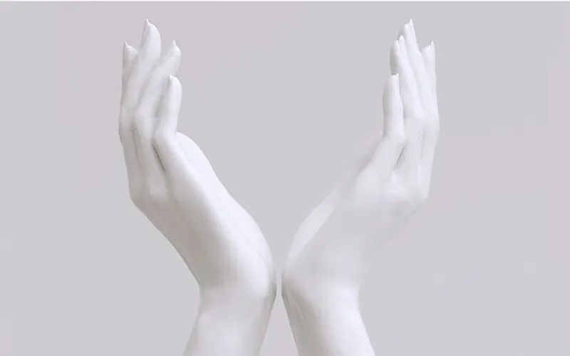 Sculpted hands symbolising precise MD Codes filler design